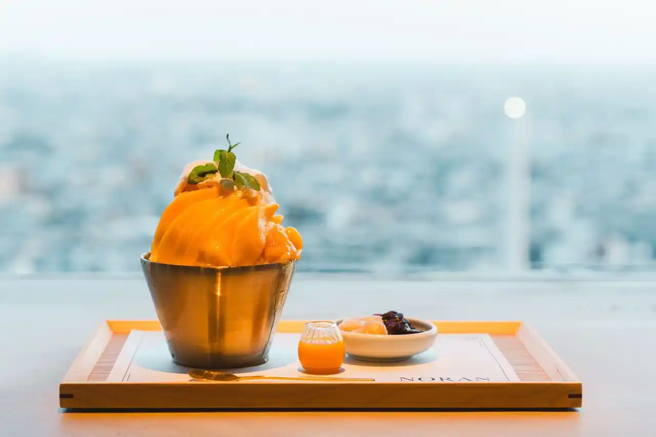 【株式会社そら】 韓国カフェで話題沸騰！【NORAN】が贈る、“進化系かき氷”「 팥빙수（パッピンス）」地上170mで味わう、甘く涼やかなときめき。