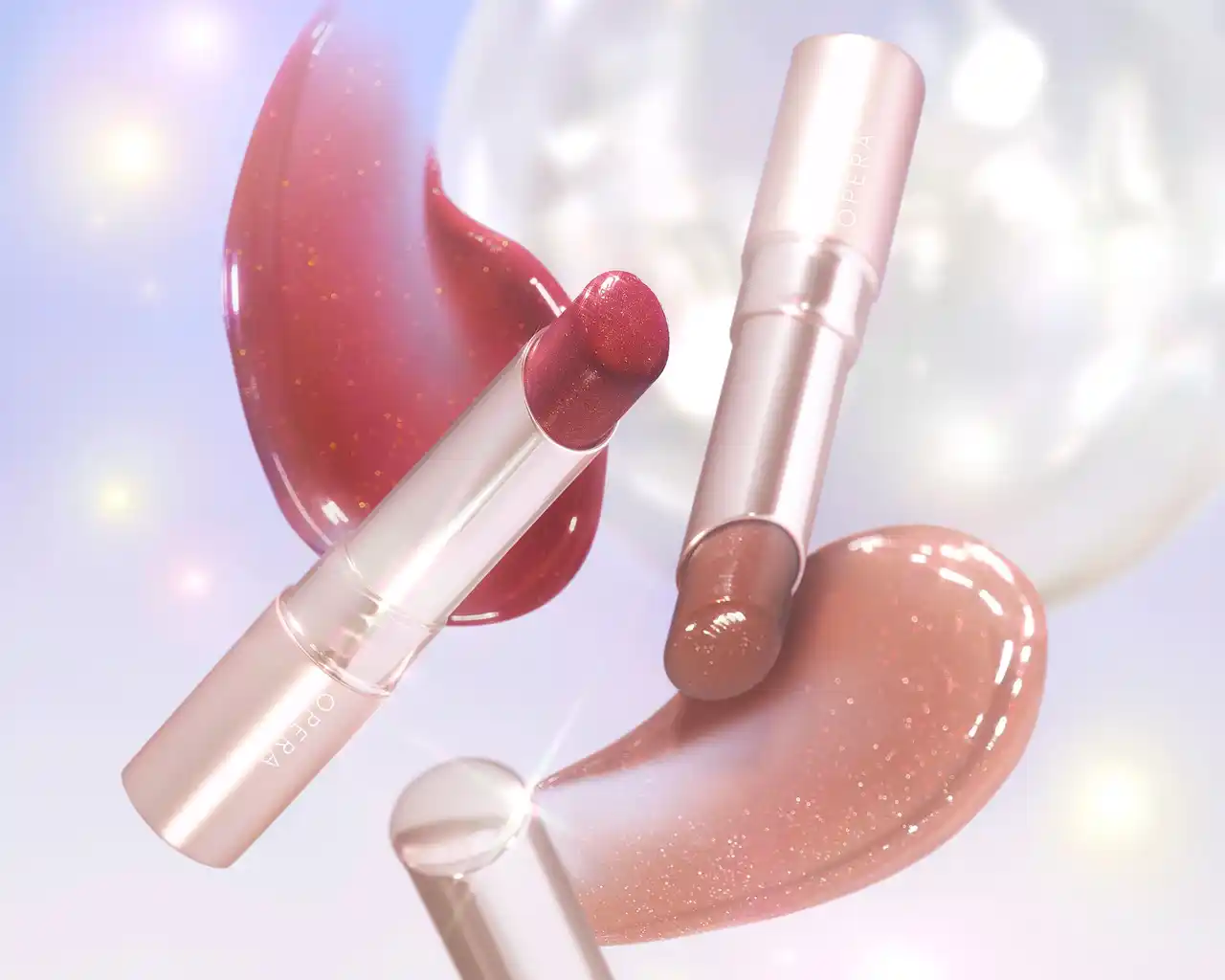 【オペラ】 オペラ「グロウリップティント」から、ぷるんとした水光ツヤ質感に仕上げるクリスマス限定色を2色発売！ダークな深みカラーに、多色にきらめく`ムーンプリズムラメ´を掛け合わせた、レッドとベージュ。